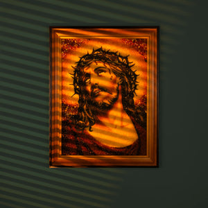 Handmade BalticBliss genuine amber artwork depicting Jesus Christ with crown of thorns, crafted from natural Baltic amber stones with warm sunset tones, unique Lithuanian religious amber art, perfect for spiritual home decor and collectors.